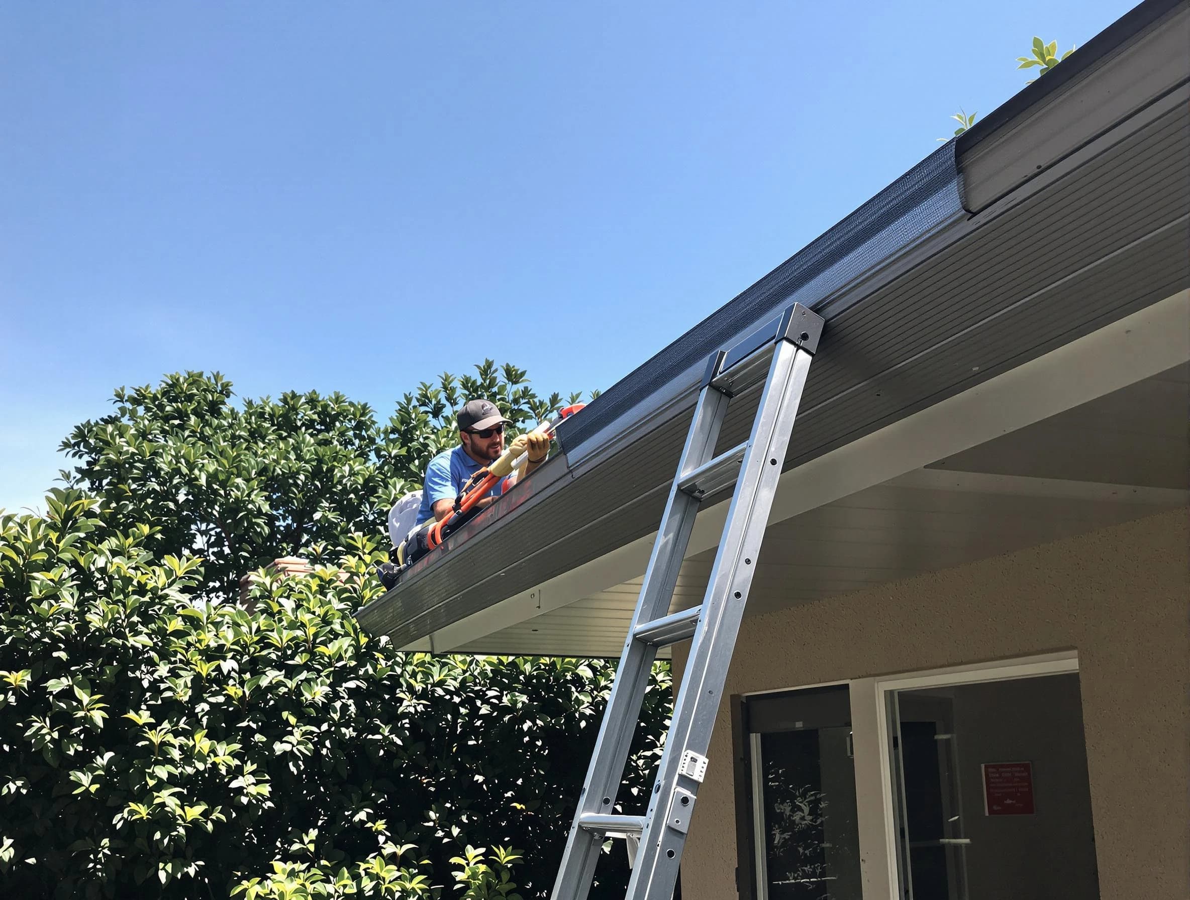 Brunswick Roofing Company installing gutter guards for a homeowner in Brunswick, OH